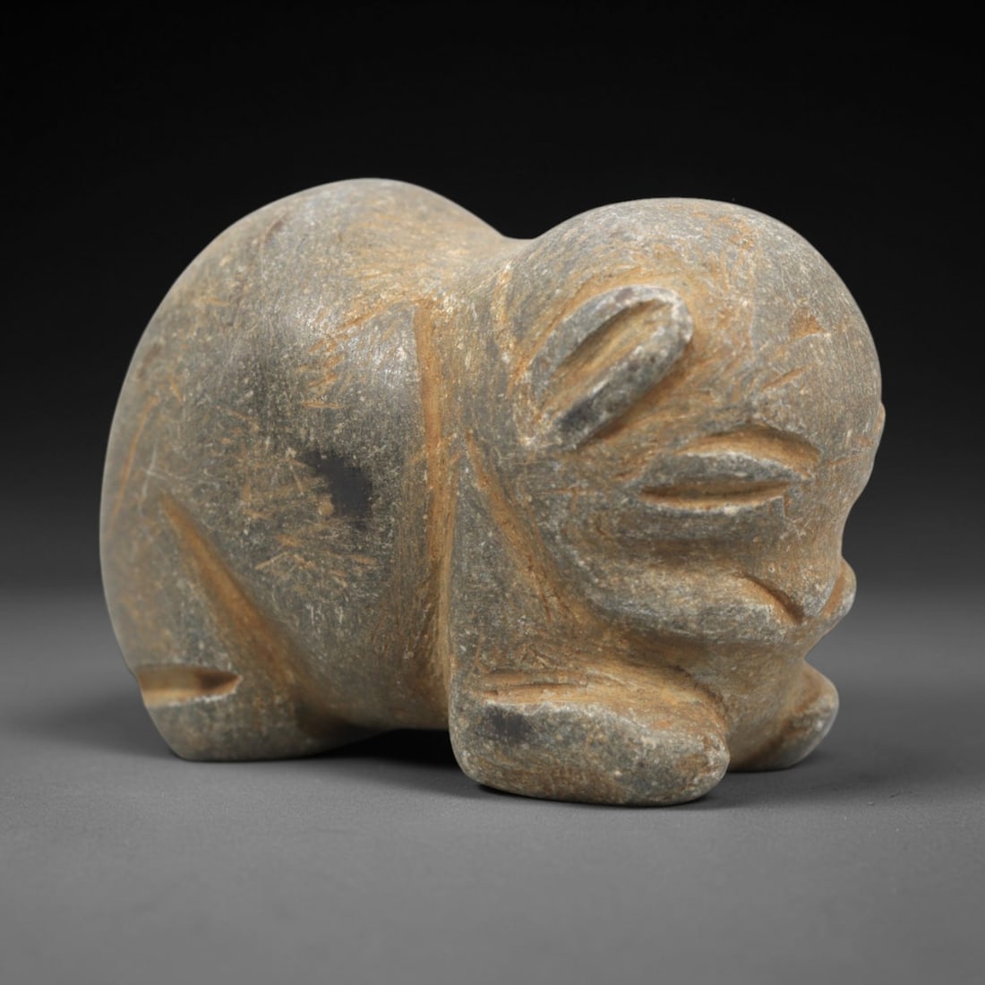 Ancient Stone Zoomorphic Amulet Effigy - Near Eastern Protective Figurine, 9ZR: This artifact is a compact stone zoomorphic amulet effigy, executed in the stylized animal tradition of the ancient Near East. The amulet depicts a rounded, crouched quadruped (likely a bear, rodent,
