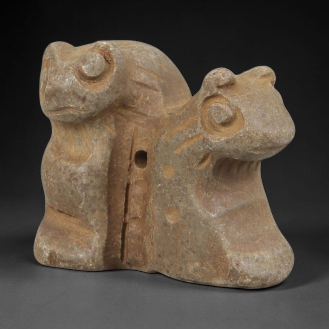 Ancient Stone Double Zoomorphic Amulet - Near Eastern Carved Pendant, 68FY: Carved from hard stone (likely steatite or limestone), this amulet takes the form of a stylized, three-dimensional double-headed zoomorphic figure (a protective composite beast, likely combining frog