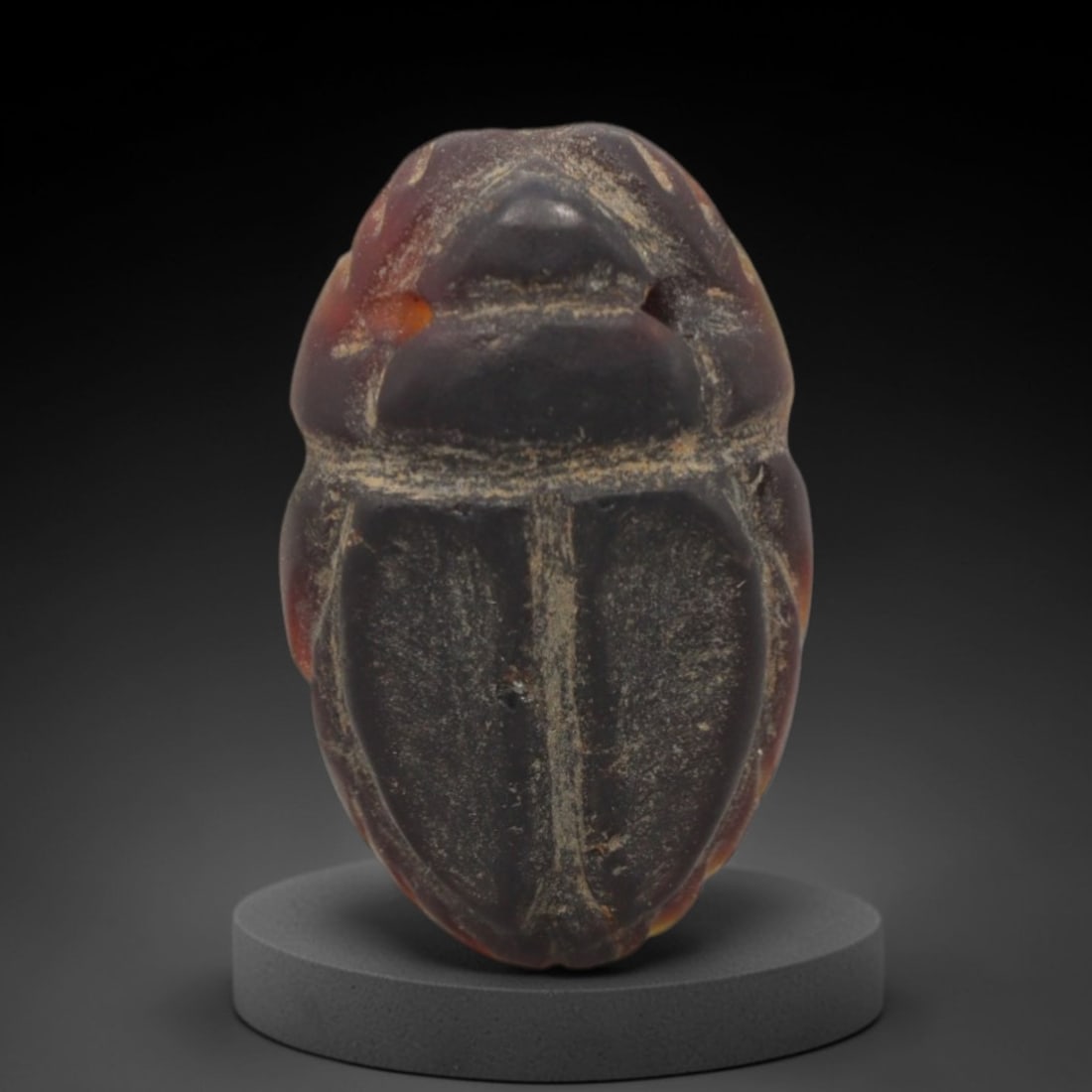Ancient Banded Agate Scarab Amulet - Egyptian Figurine, 89XS: Carved from striking banded agate with deep plum-red, amber-orange, and subtle creamy natural inclusions, this amulet is formed as a stylized scarab beetle with incised linear detailing to define the