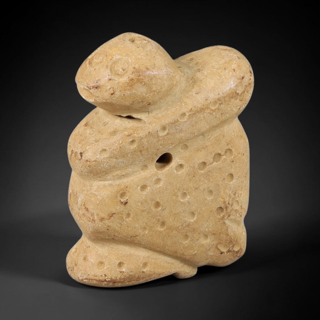Ancient Stone Anthropomorphic Amulet - Near Eastern Carved Figurine, 56BA: Carved from light-colored hardstone, this amulet takes the form of a stylized anthropomorphic (humanoid) figure, rendered in three dimensions with simplified, bold carving. The figure is decorated wit