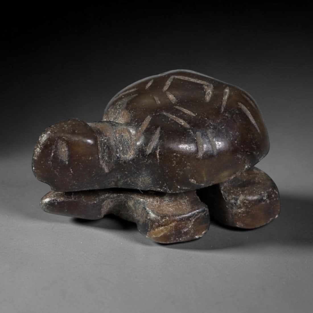 Antique Qing Jade Tortoise Amulet - Chinese Animal Figurine, 42XT: Carved from a deep, dark brown jade with a polished surface and natural mineral inclusions, this miniature tortoise amulet features incised linear detailing on the shell to define scute patterns, with