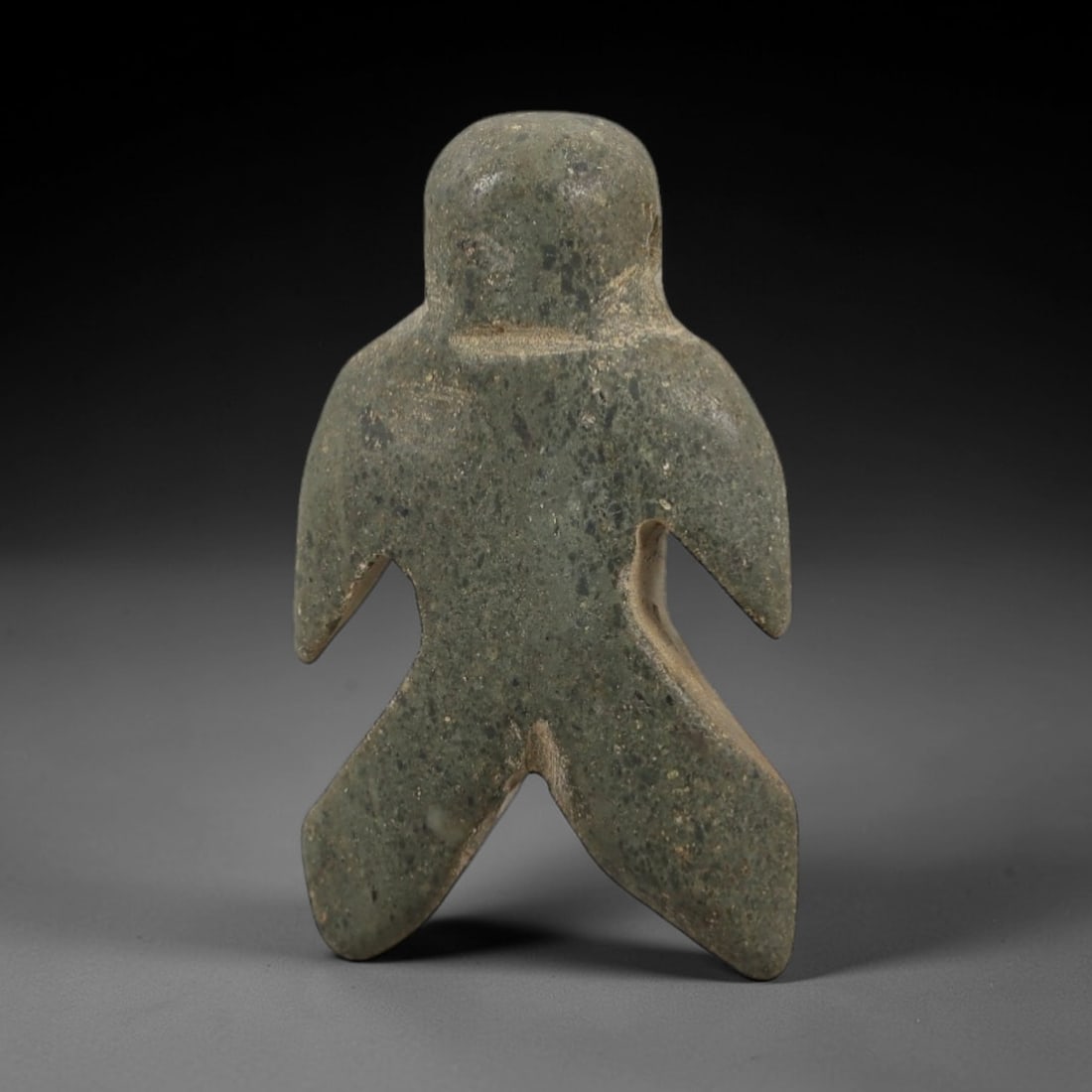 Ancient Egyptian Stone Amulet - Anthropomorphic Figure, 50AE: Carved from stone, this ancient Egyptian amulet features a stylized anthropomorphic form with simplified limbs and a central torso, typical of protective amulets from the Late Period (c. 664-332 BCE).