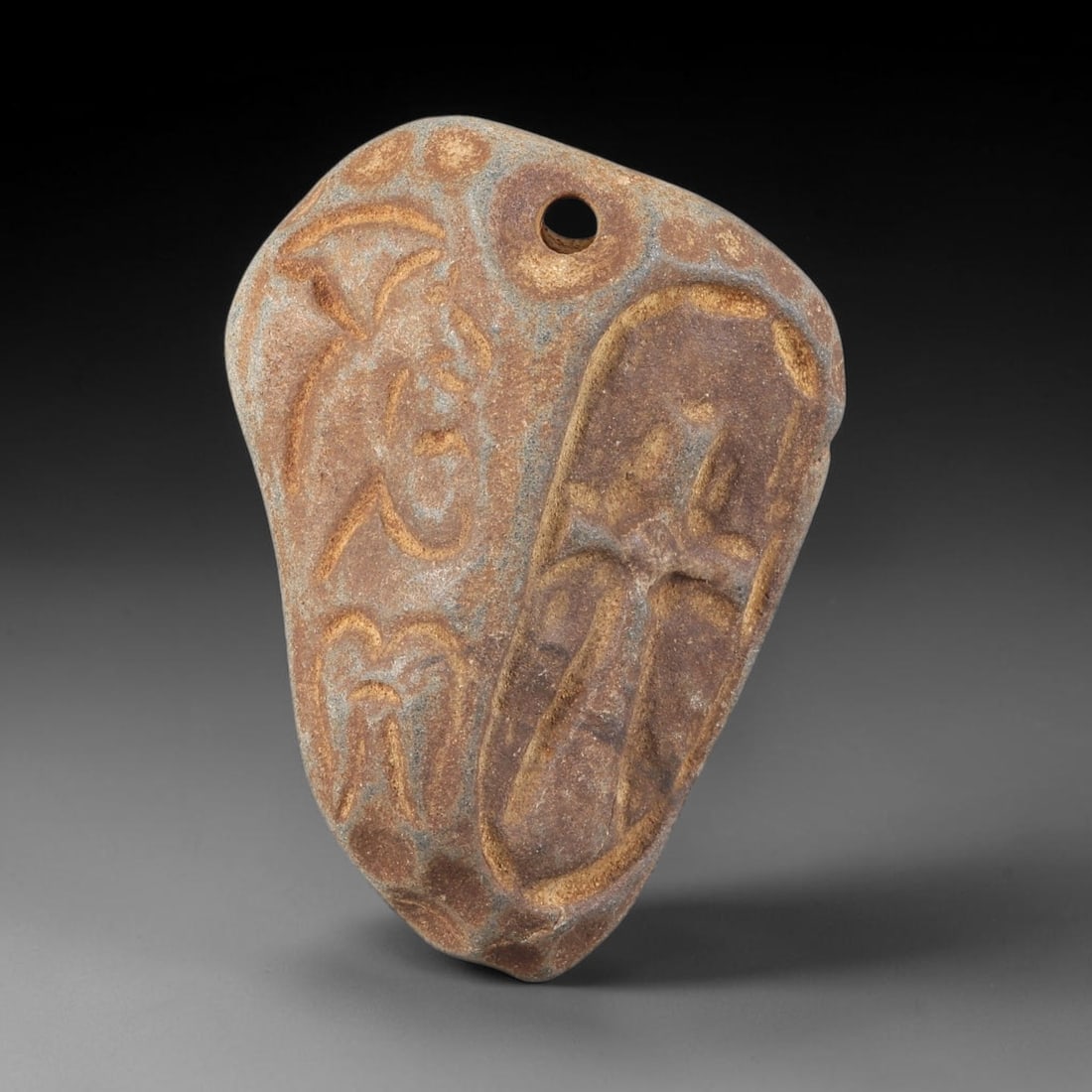 Ancient Stone Cross Amulet - Christian Religious Pendant, 69ZT: Carved from a naturally shaped, grey-brown stone with a warm, aged patina, this Christian amulet features two distinct incised designs: a prominent, deeply carved Latin cross on one side, and stylized