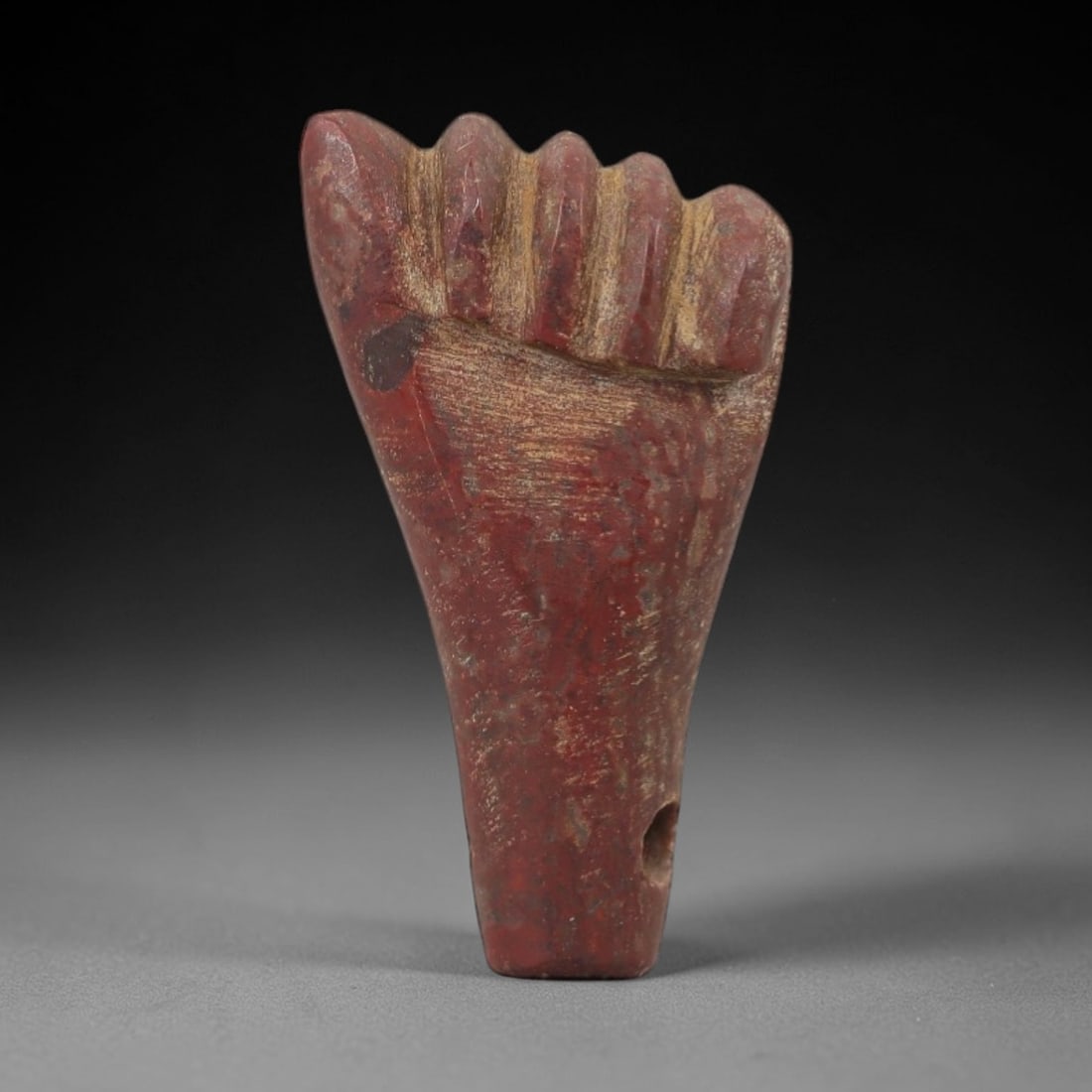 Ancient Red Stone Fist Amulet - Egyptian Style Figurine, 48AE: Carved from red stone, this ancient Egyptian-style fist amulet features a compact, hand-like form with defined finger details and a suspension hole at the top, indicating its use as a wearable amulet.