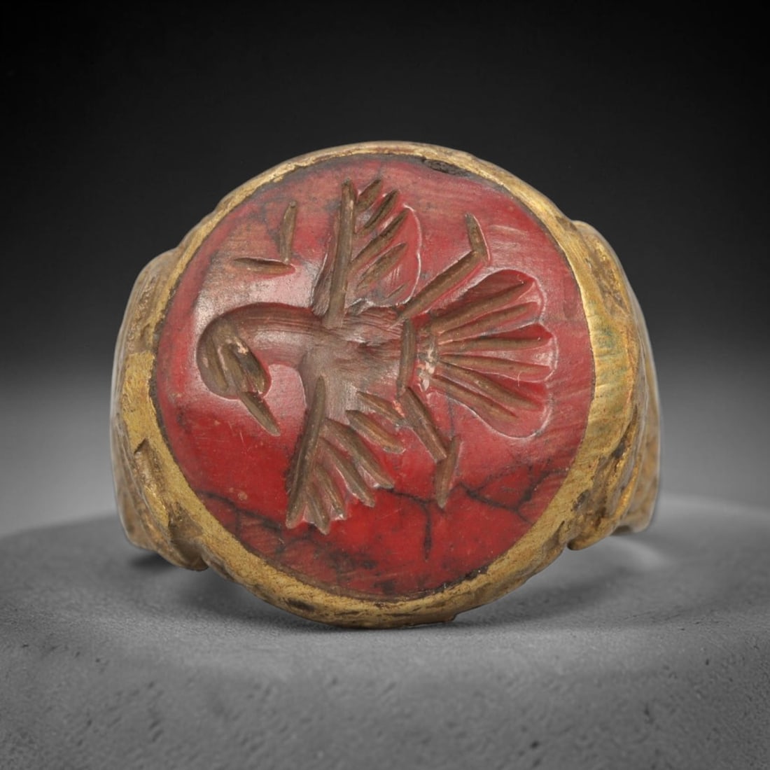 Antique Qajar Dynasty Brass Red Stone Intaglio Ring - Size 7 US, 72ZX: This antique Qajar dynasty brass intaglio ring features a round red stone intaglio inset carved with a detailed eagle motif, set within an ornate brass mount. The ring is crafted from brass, with the