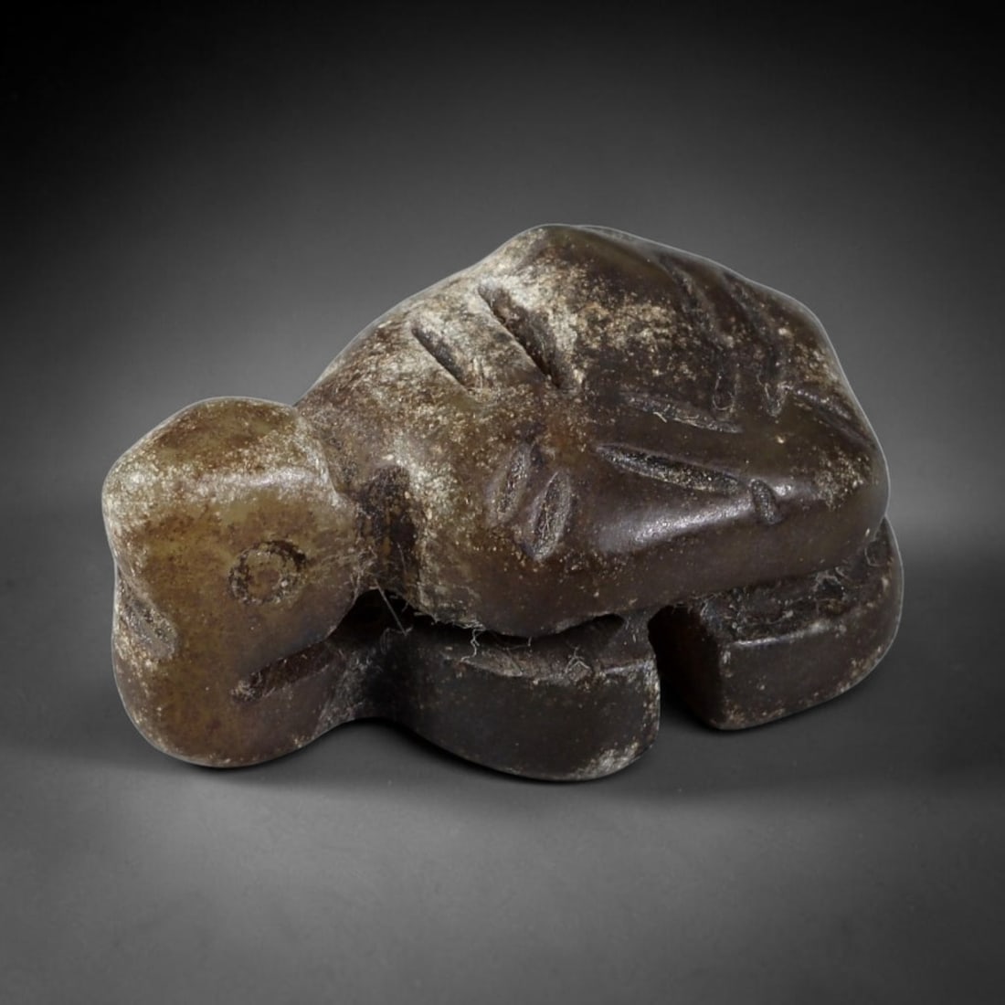 Antique Qing Jade Tortoise Amulet - Chinese Animal Figurine, 45XT: Carved from a dark, earthy jade with a heavily weathered, aged patina and mineral encrustation, this miniature tortoise amulet features incised linear detailing on the shell to define scute patterns,