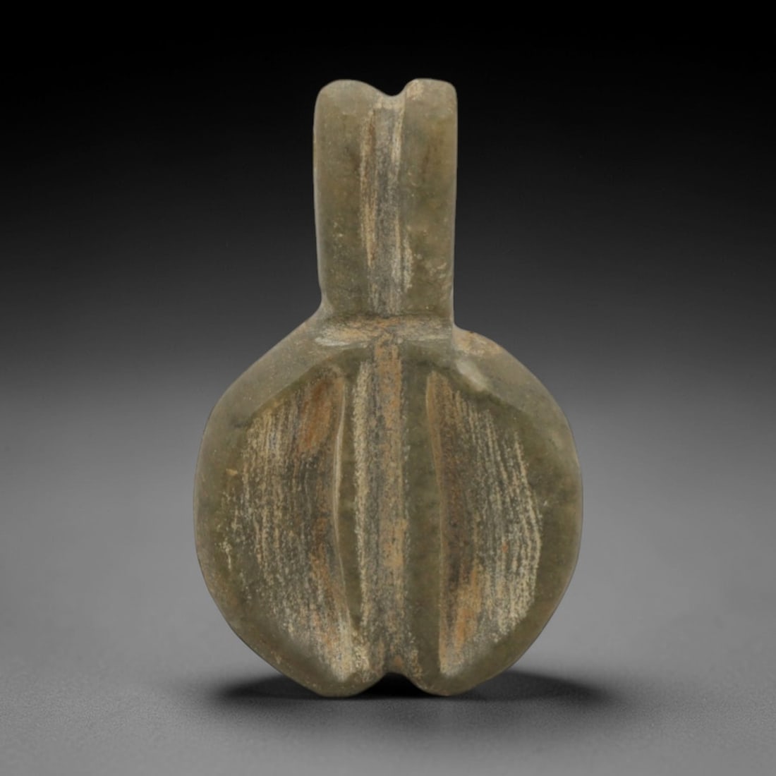 Ancient Stone Phallic Amulet - Egyptian Pendant, 74XQ: Carved from a mottled greenish stone, this amulet takes a distinct phallic form with an integrated suspension loop at the apex, typical of ancient Egyptian fertility and protection symbolism. The simp