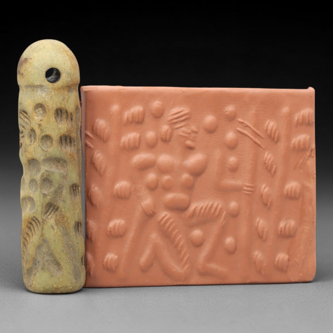 Ancient Serpentine Cylinder Seal - Mesopotamian, 61ZT: Carved from serpentine, this cylinder seal follows the classic cylindrical form of ancient Mesopotamian administrative and ritual artifacts. Attributed to the Bronze Age Mesopotamian cultures, this se