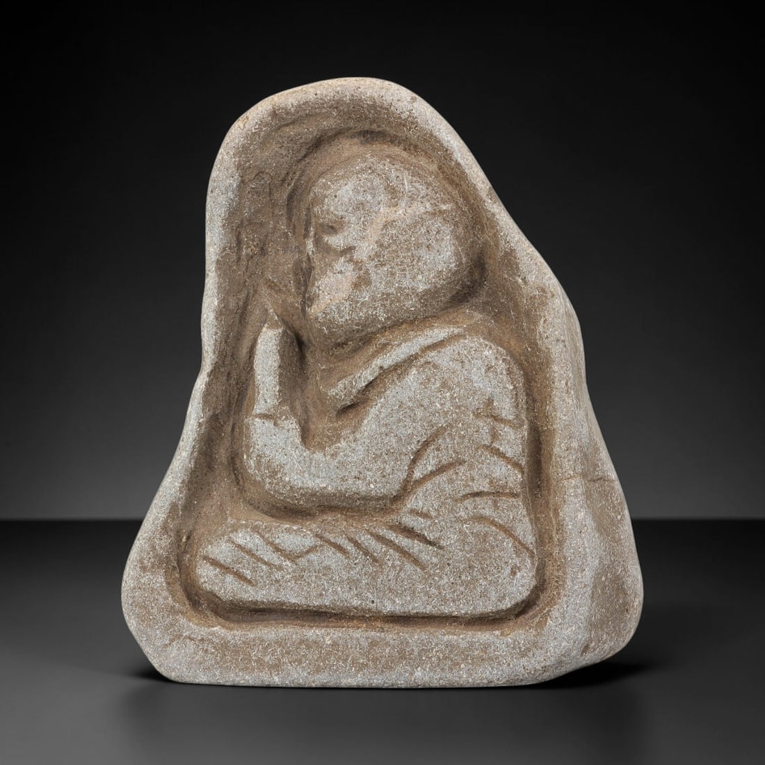 Antique Stone Carving - Japanese Edo Period Seated Buddha, 40WJ: Carved from stone, this antique Japanese Edo period votive carving depicts a seated Buddha or Buddhist monk in the posture of meditation, with hands pressed together in anjali mudra and simplified yet