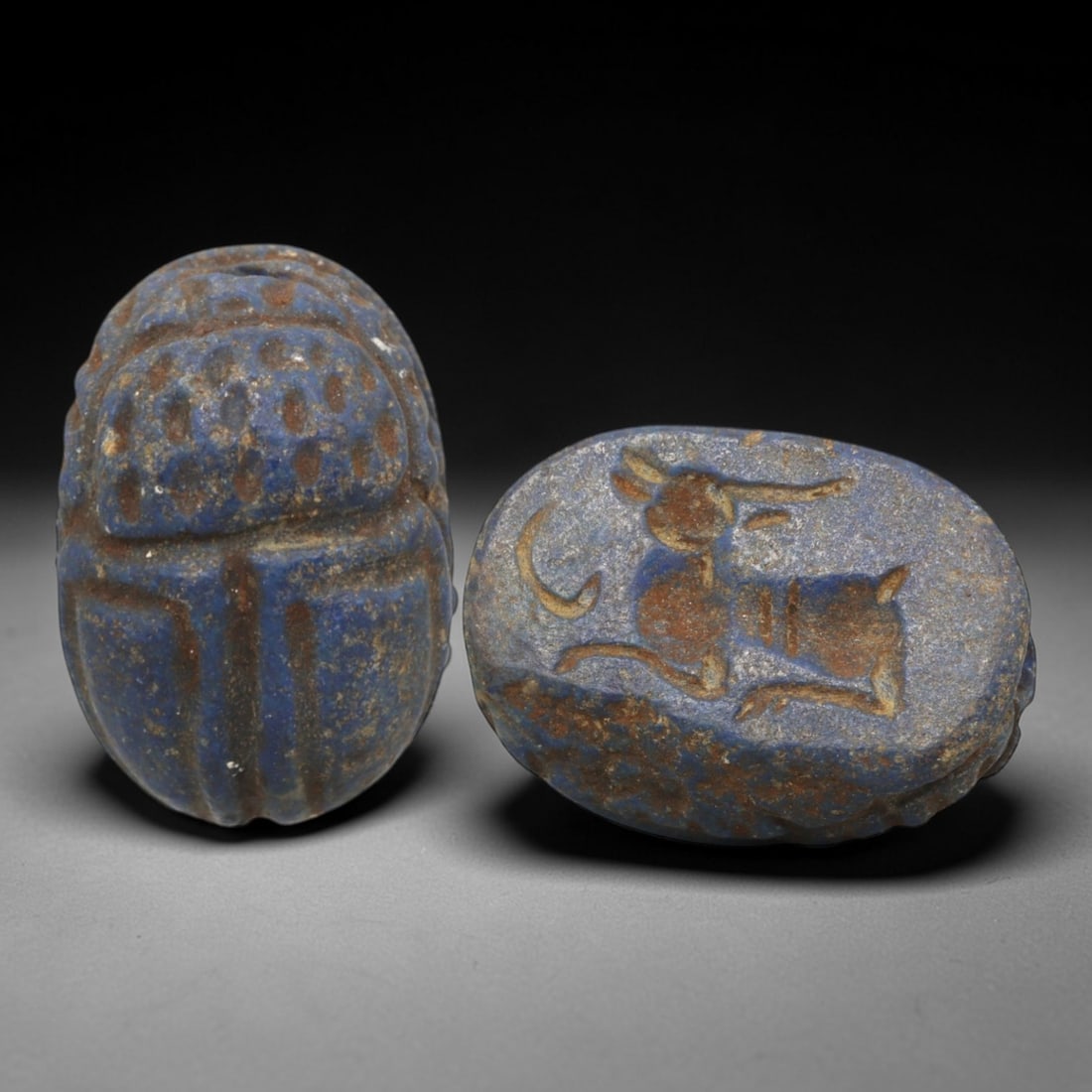 Ancient Lapis Lazuli Scarab - Near Eastern Zoomorphic Seal, 19XT: This artifact is hand-carved from lapis lazuli, employing traditional ancient lapidary techniques consistent with Near Eastern Bronze Age seal craftsmanship. The object takes the form of a scarab beet