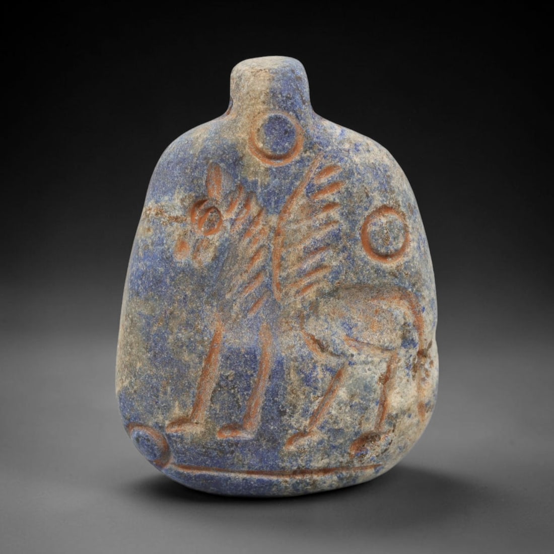 Ancient Lapis Lazuli Winged Horse Amulet - Near Eastern Carved Pendant, 21WJ: Carved from lapis lazuli, this pendant takes the form of a flattened, bottle-shaped amulet, featuring an incised profile of a winged horse (pegasus) rendered in a stylized, ancient Near Eastern artist