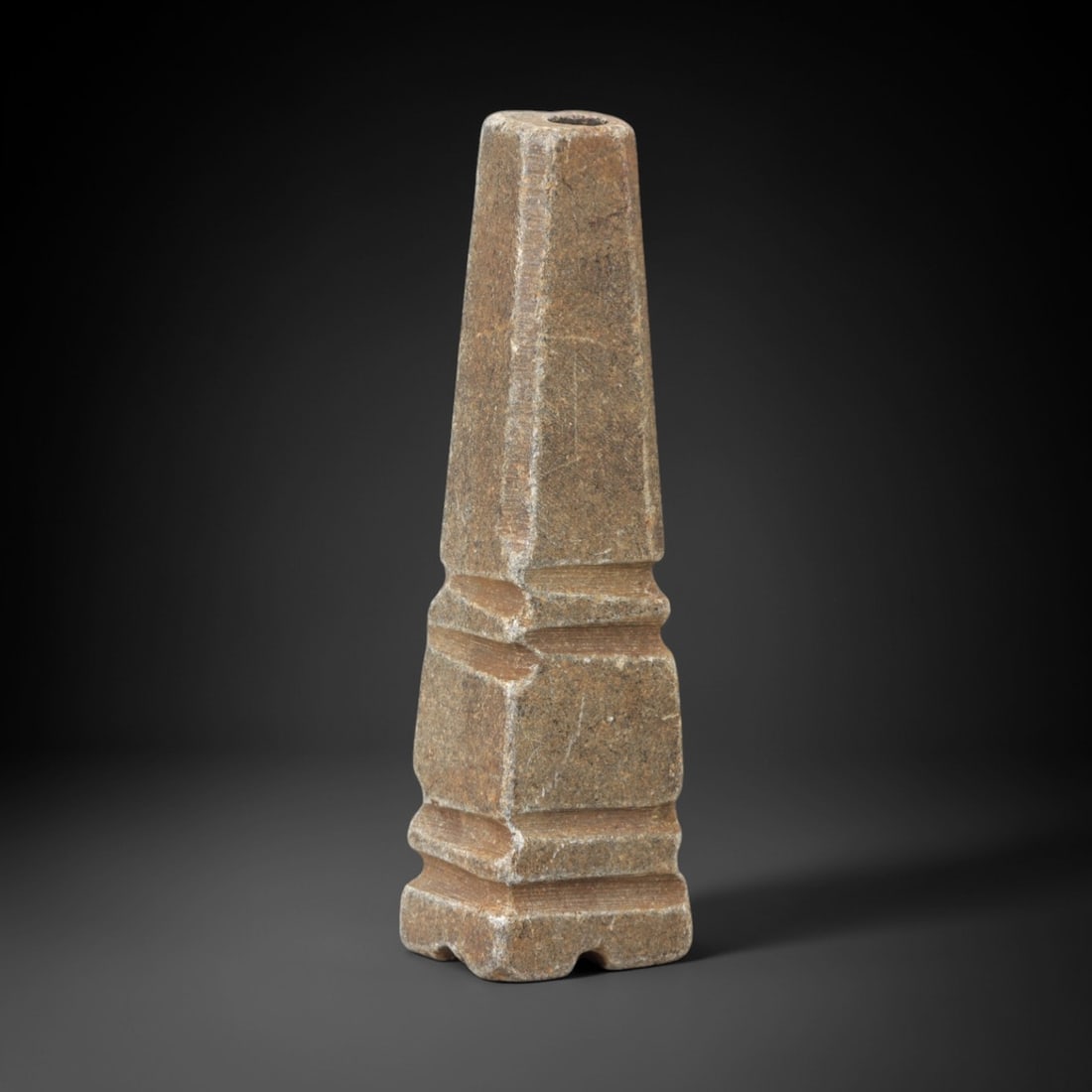 Ancient Schist Kohl Vessel - Near Eastern Cosmetic Container, 3AL: Carved from schist, this kohl vessel features a tapering, stepped form with a central perforation at the top for holding kohl, a cosmetic used for eye adornment in ancient cultures. Attributed to the