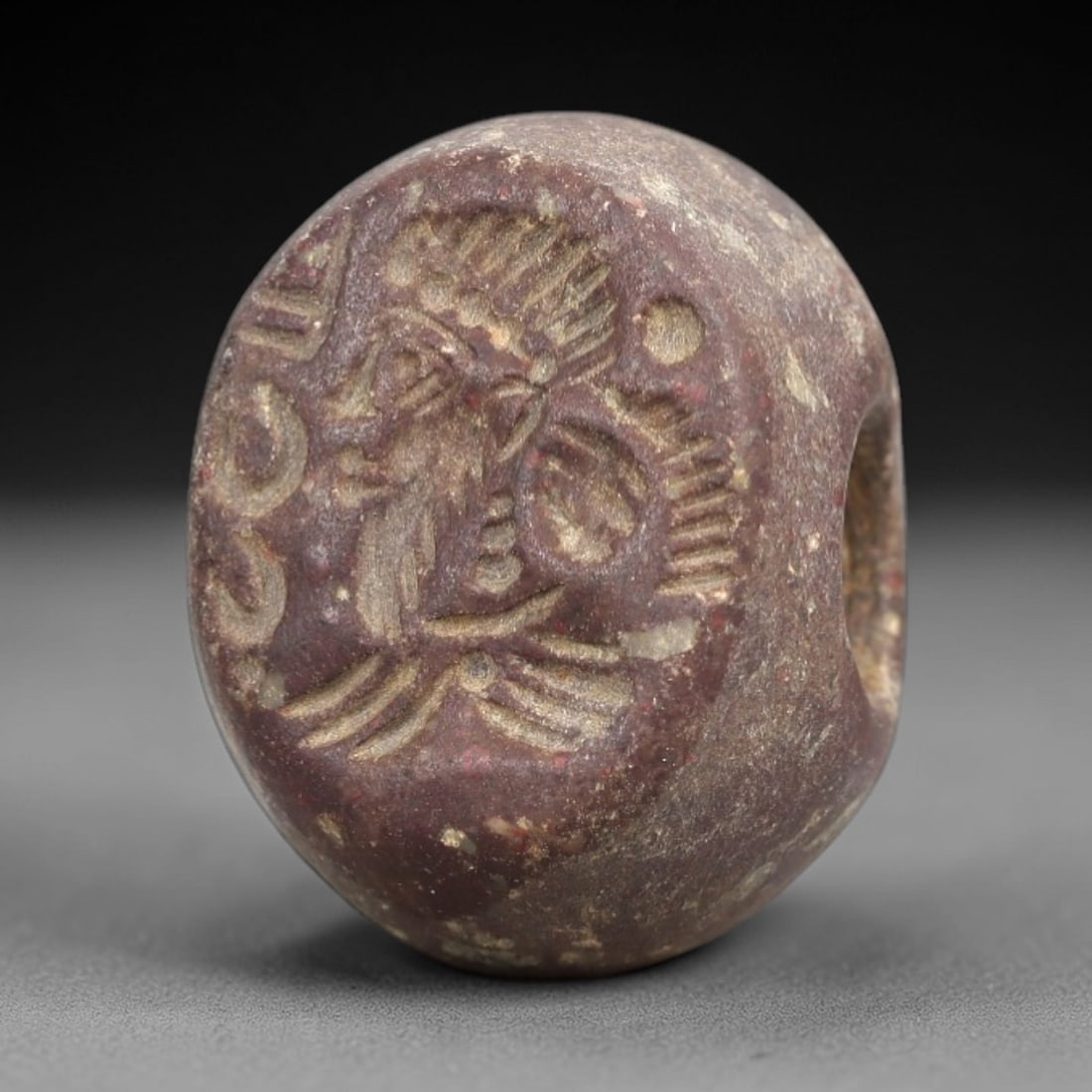 Ancient Stone Hemispherical Stamp Seal - Near Eastern Deity Amulet, 42AN: This ancient Near Eastern hemispherical stamp seal is carved from a dense, reddish-brown stone, likely steatite or chlorite, with a heavily weathered, earthy patina indicative of long-term burial. The