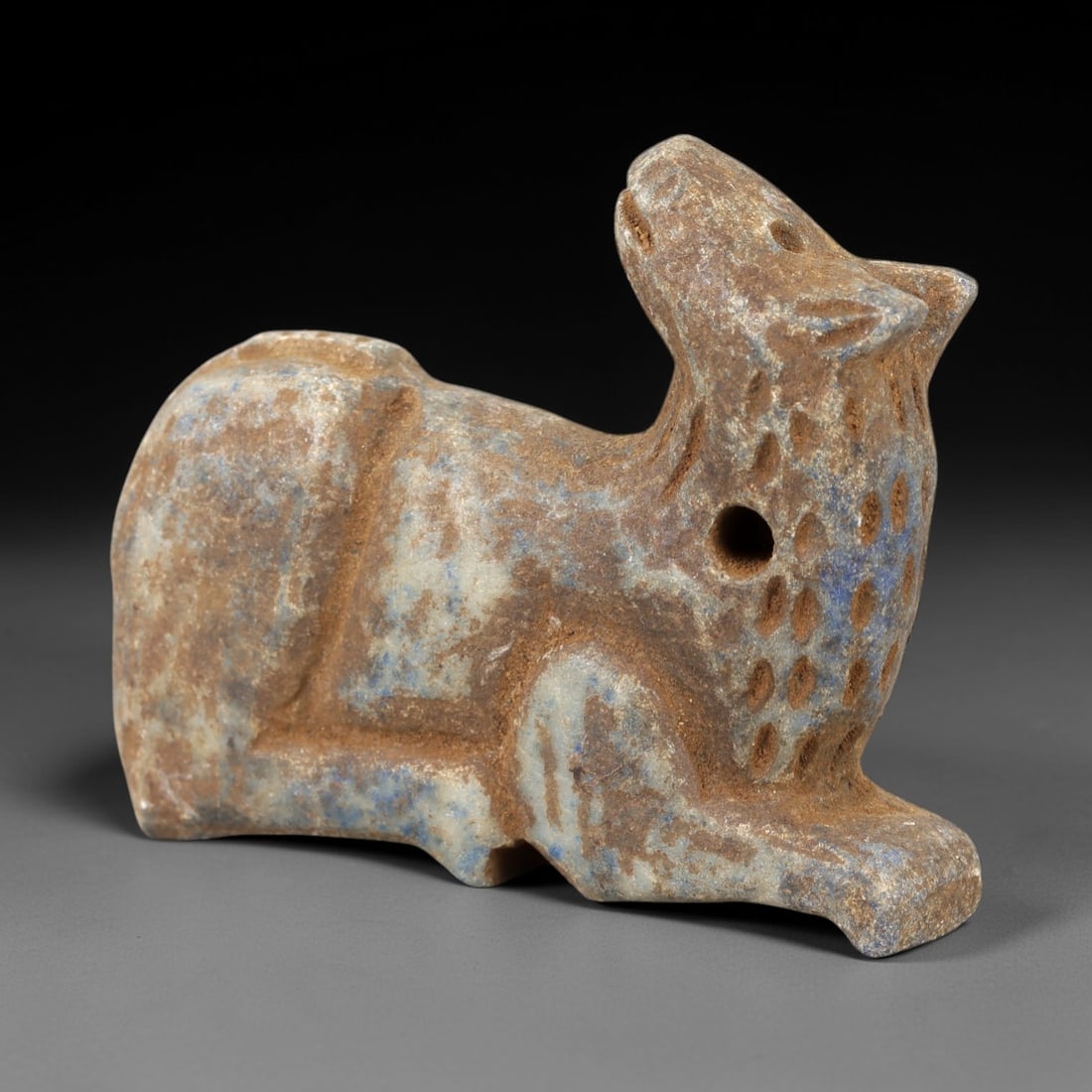 Ancient Lapis Lazuli Camel Amulet - Near Eastern Animal Talisman, 61AM: This amulet is carved from rich blue lapis lazuli with natural earthy inclusions, depicting a stylized camel in a recumbent, crouched posture. The piece features incised linear and stippled detailing