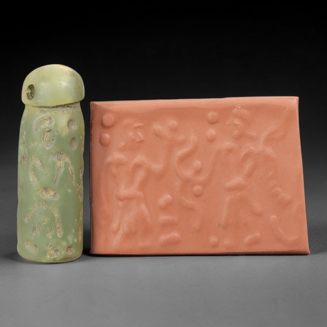 Ancient Serpentine Cylinder Seal - Mesopotamian, 82FX: Carved from serpentine, this cylinder seal follows the classic cylindrical form of ancient Mesopotamian administrative and ritual artifacts. Attributed to the Bronze Age Mesopotamian cultures, this se