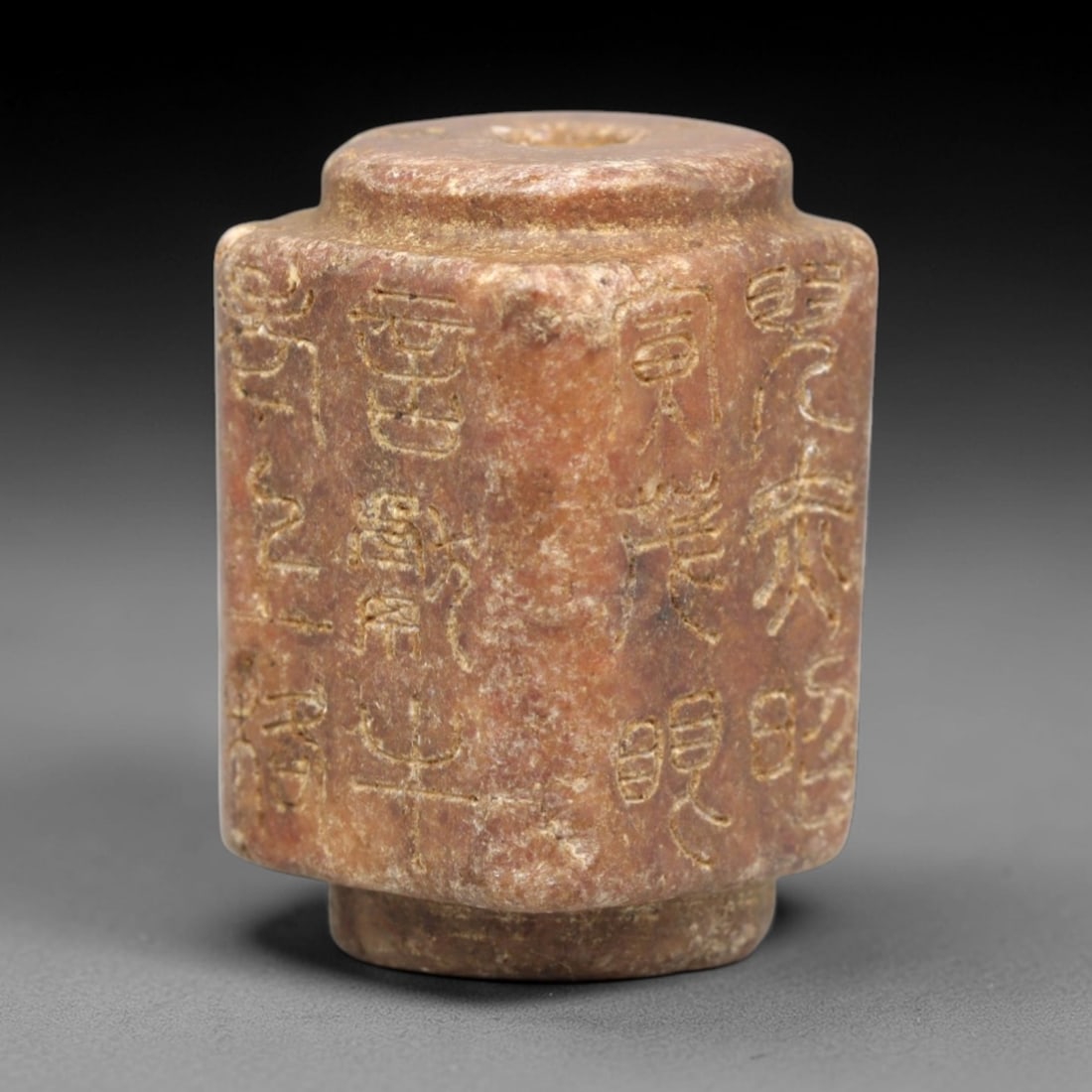 Antique Chinese Agate Bead - Qing Dynasty Inscribed Pendant, 54ZP: This cylindrical antique bead is carved from warm-toned agate, featuring a central perforation for stringing, with vertical incised seal script inscriptions wrapping around its faceted sides. Stylisti
