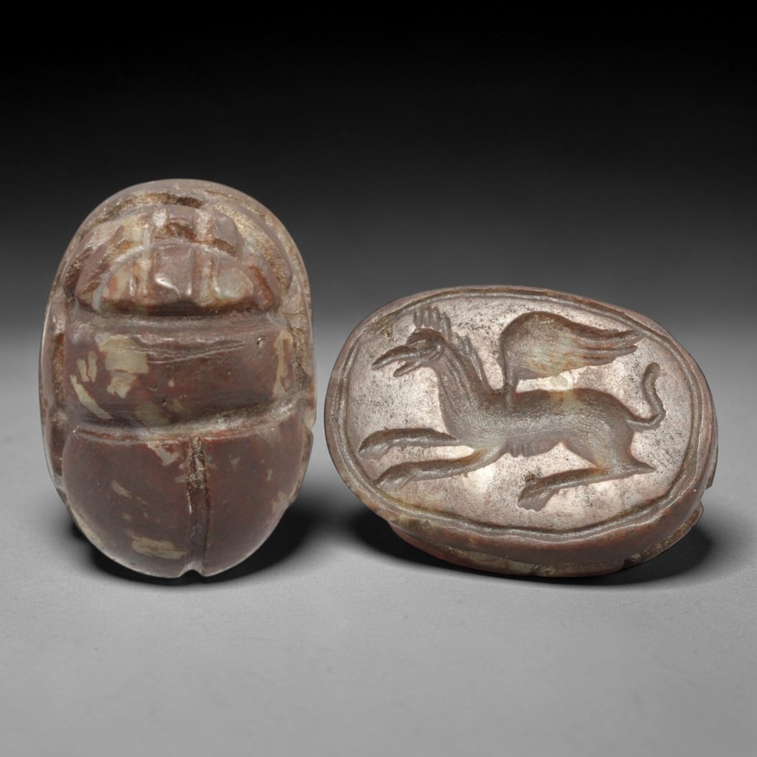 Ancient Hardstone Scarab - Near Eastern Hippocampus Zoomorphic Seal, 24XT: This artifact is hand-carved from a rich reddish-brown hardstone with natural pale veining, utilizing traditional ancient seal craftsmanship consistent with Near Eastern or Phoenician Iron Age traditi