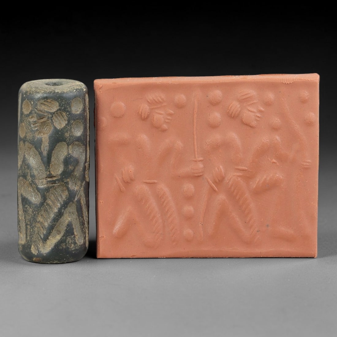 Ancient Serpentine Cylinder Seal - Mesopotamian Figural Battle Motif, 70FX: Carved from serpentine, this cylinder seal follows the classic cylindrical form of ancient Mesopotamian administrative and ritual artifacts. Its surface bears a detailed narrative scene depicting mult