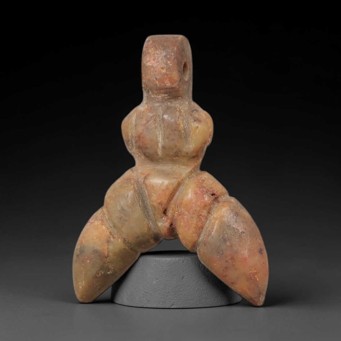 Ancient Stone Fly Amulet - Egyptian Ritual Figurine, 53AG: This amulet is carved from a single piece of mottled tan and reddish-brown stone, exhibiting a fine-grained texture with subtle ochre patina and natural mineral veining across its surface. The form is