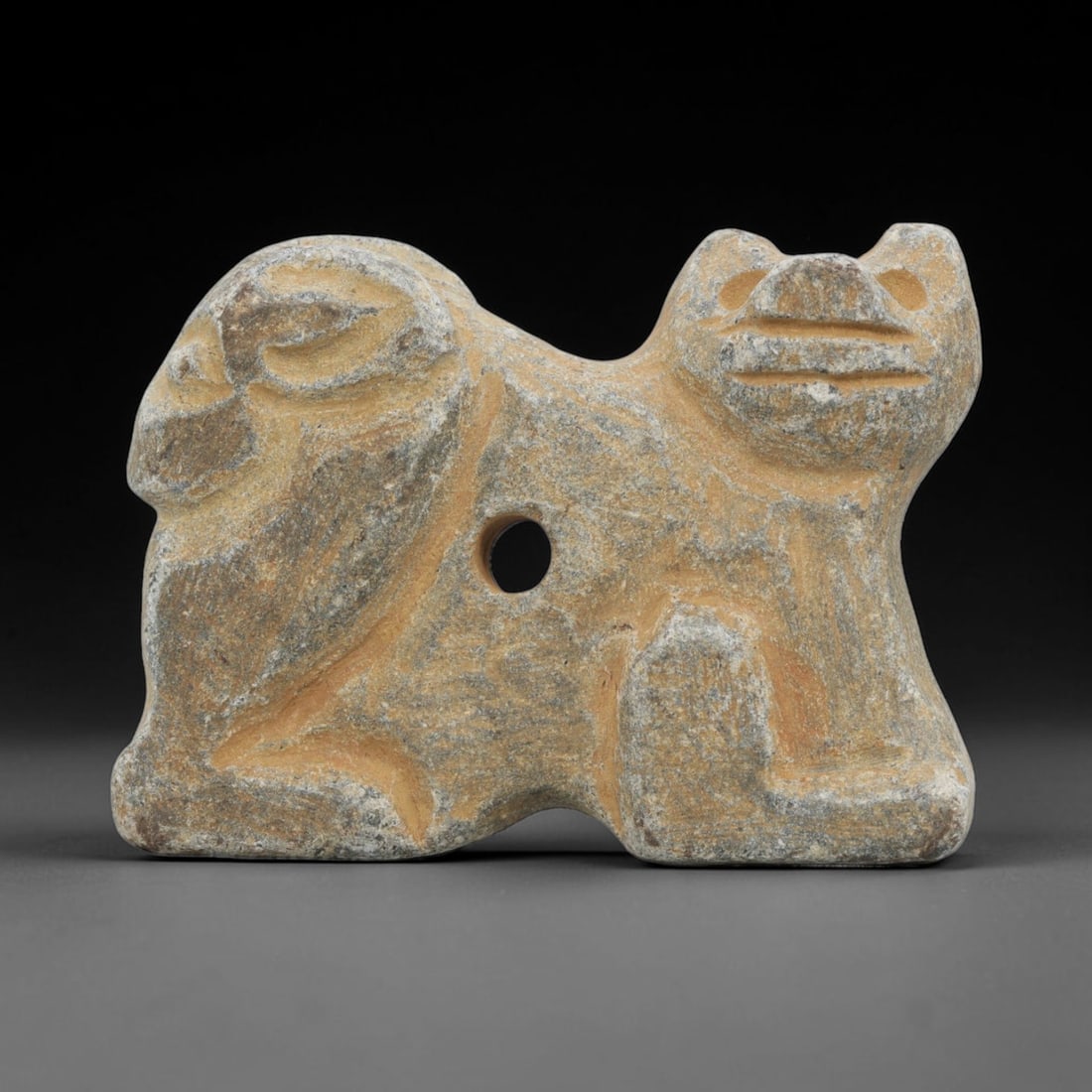 Ancient Schist Dual-Figure Amulet - Near Eastern Carved Figurine, 99ZT: Carved from schist, the amulet features a dual zoomorphic figural design: a stylized feline or canine head on the right, detailed with simplified circular eyes and a linear-carved muzzle, and a second