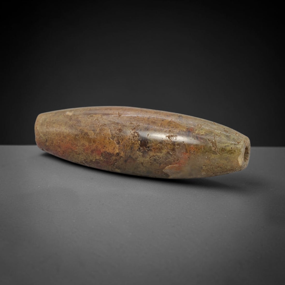 Ancient Jasper Bead - Indus Valley Bactrian Pendant: This bead is expertly carved from natural jasper, showcasing masterful lapidary craftsmanship consistent with ancient bead-making traditions of the Indus Valley and Bactrian regions. The elongated bic