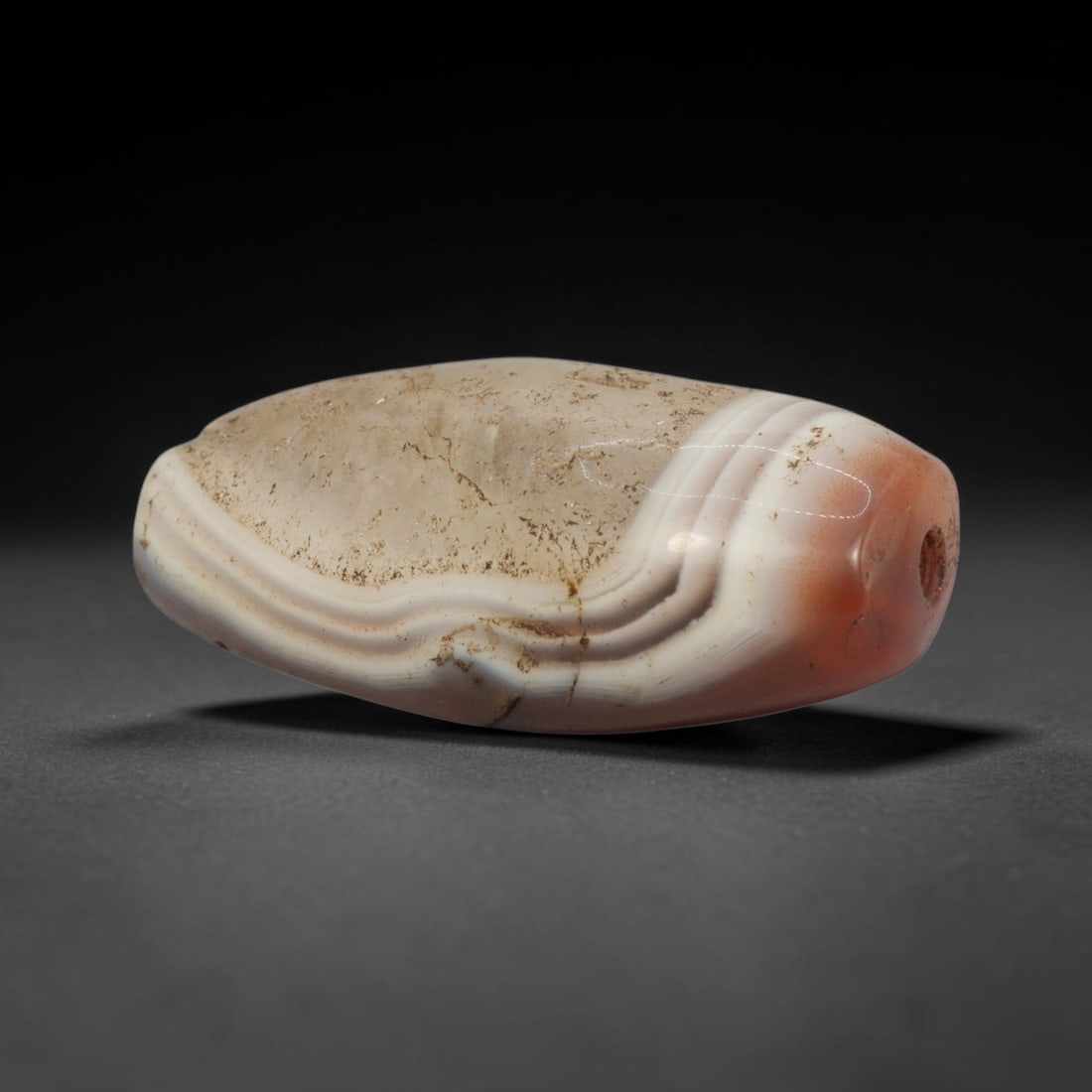 Ancient Banded Carnelian Agate Bead - Indus Valley Bactrian Pendant, 80XT: This bead is masterfully carved from richly banded translucent carnelian agate, showcasing exceptional lapidary craftsmanship consistent with ancient bead-making traditions of the Indus Valley and Bac