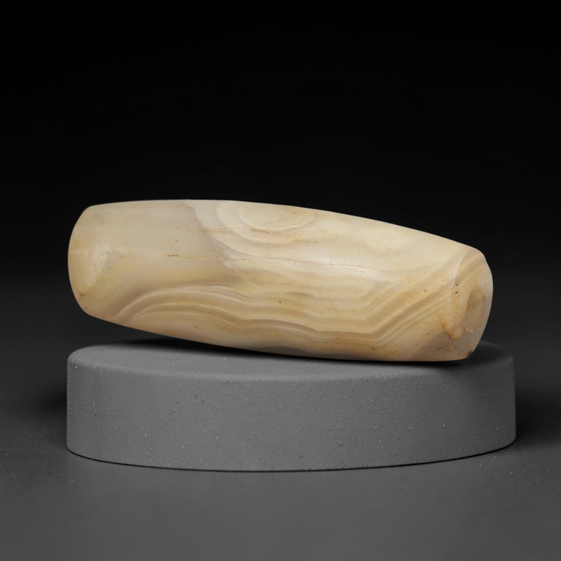 Ancient Agate Bead - Silk Road Bactrian Amulet, 52XT: This bead is carved from banded agate, showcasing meticulous lapidary work typical of ancient bead craftsmanship across the Bactrian and Silk Road regions. The elongated barrel form features a central