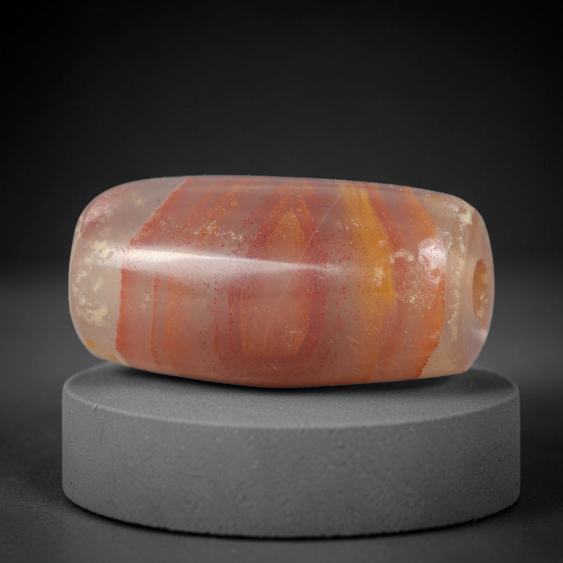 Ancient Agate Bead - Silk Road Cylinder Amulet, 96BD: Carved from banded agate (carnelian variant), the bead features a smooth cylindrical barrel form with a polished surface that highlights the stone's striking warm reddish-orange and golden concentric