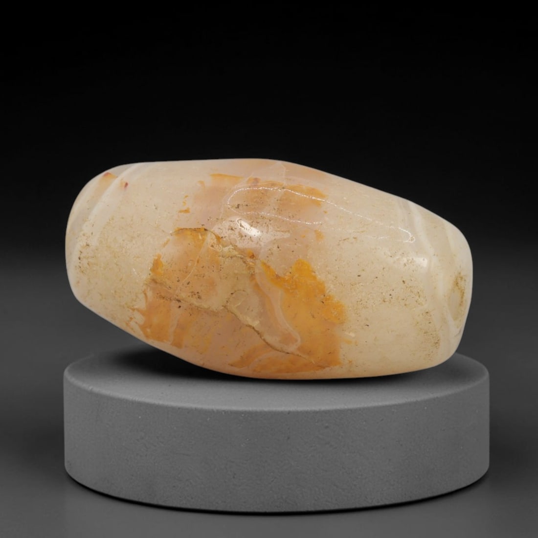 Ancient Agate Bead - Silk Road Bactrian Amulet, 43XW: This bead is expertly carved from natural agate, showcasing masterful lapidary craftsmanship consistent with ancient Bactrian and Silk Road bead-making traditions. The elongated ovoid form features a