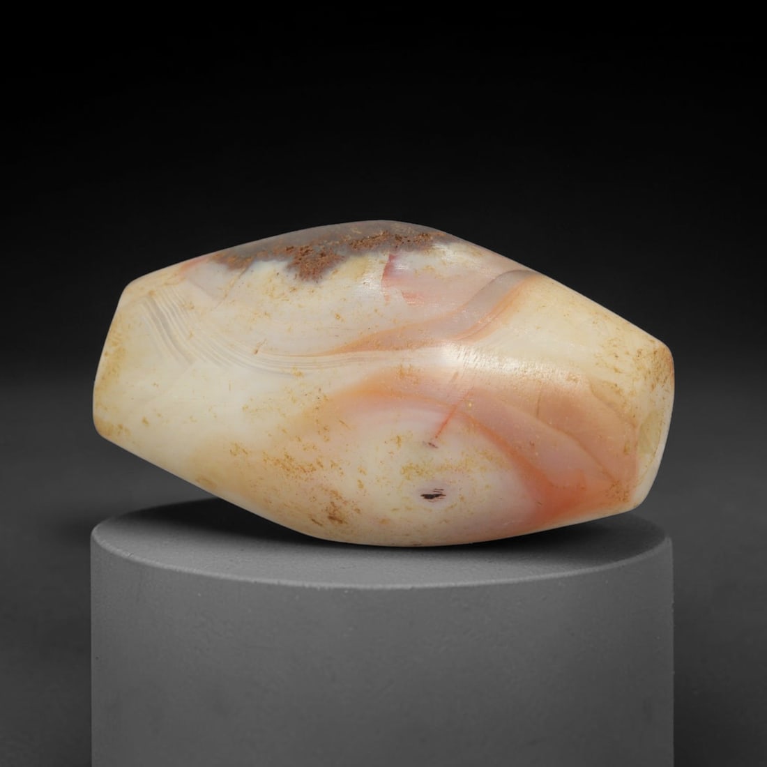 Ancient Banded Agate Bead - Indus Valley Bactrian Pendant: This bead is masterfully carved from richly banded translucent agate, showcasing exceptional lapidary craftsmanship consistent with ancient bead-making traditions of the Indus Valley and Bactrian regi