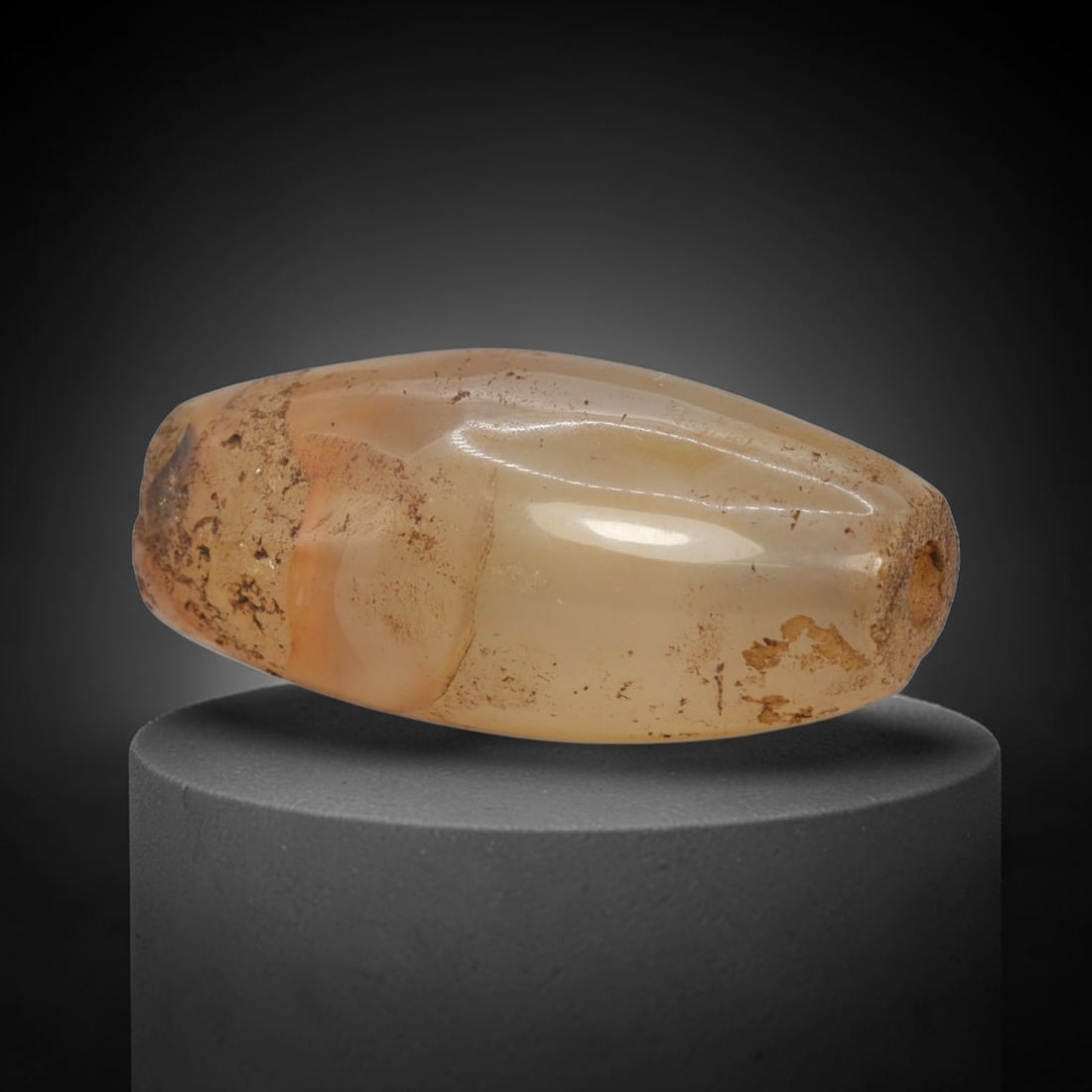 Ancient Faceted Banded Agate Bead - Indus Valley Bactrian Pendant: This bead is masterfully carved from translucent banded agate, showcasing exceptional lapidary craftsmanship consistent with ancient bead-making traditions of the Indus Valley and Bactrian regions. Th