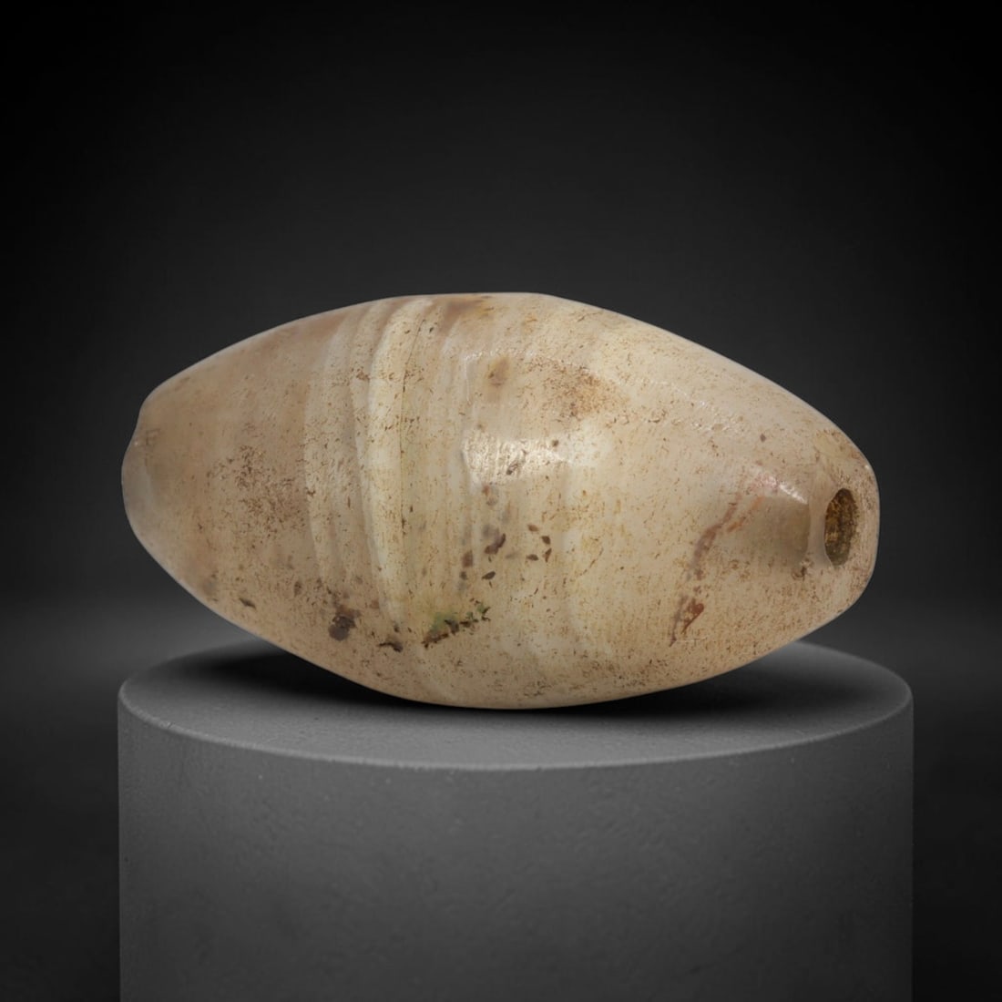 Ancient Banded Agate Bead - Indus Valley Bactrian Pendant: This bead is masterfully carved from naturally banded translucent agate, showcasing exceptional lapidary craftsmanship consistent with ancient bead-making traditions of the Indus Valley and Bactrian r