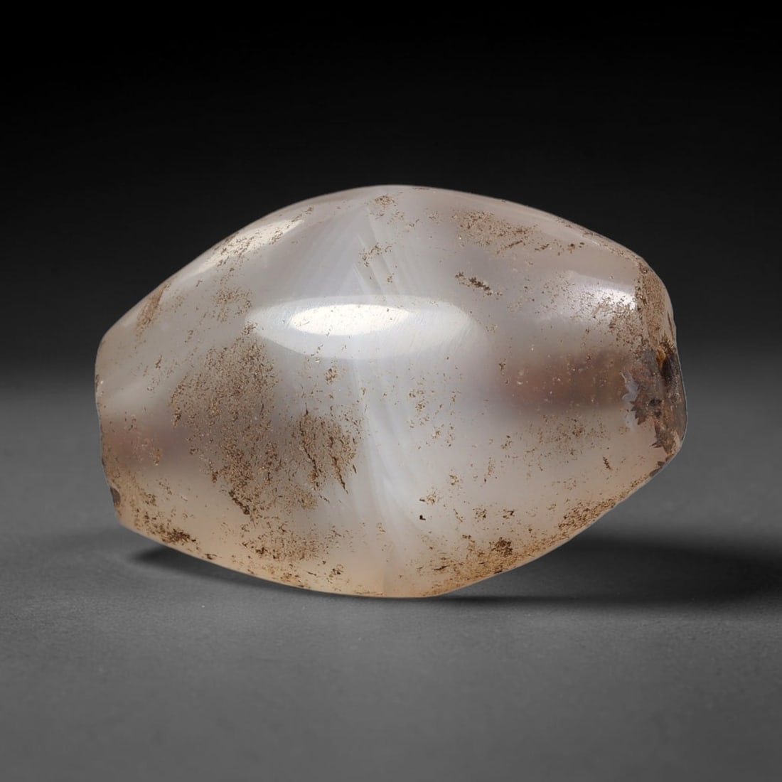 Ancient Agate Bead - Silk Road Amulet: Carved from translucent banded agate, the bead features a barrel form with a smooth, polished surface that highlights the stone's pale milky base and subtle internal banding. A longitudinal perforatio