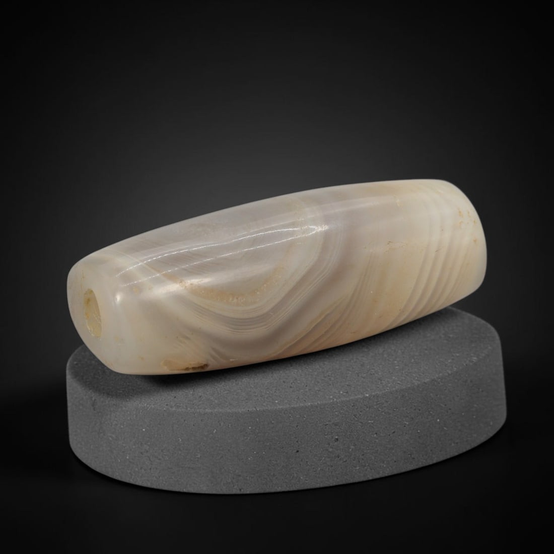 Ancient Banded Agate Bead - Indus Valley Bactrian Pendant: This bead is masterfully carved from elegantly banded translucent agate, showcasing exceptional lapidary craftsmanship consistent with ancient bead-making traditions of the Indus Valley and Bactrian r
