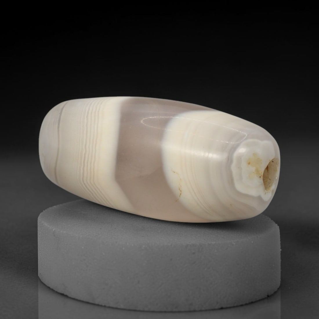 Ancient Agate Bead - Silk Road Bactrian Pendant: This bead is carved from boldly banded agate, exhibiting expert lapidary workmanship consistent with ancient bead-making traditions of the Bactrian and Silk Road regions. The elongated barrel form fea