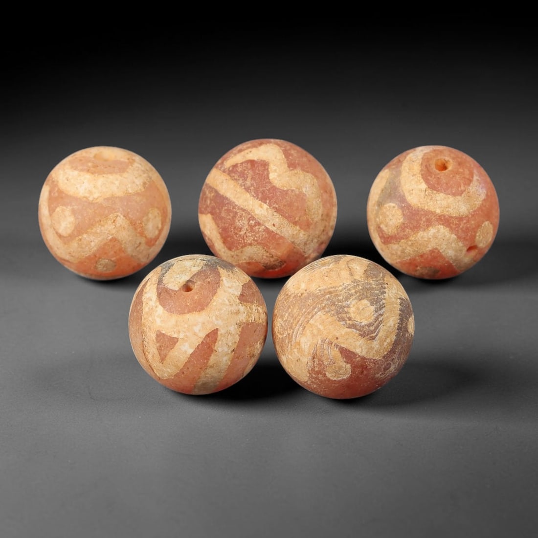 Ancient Gandhara Etched Carnelian Beads, Set of 5, 38BE: A set of 5 ancient etched carnelian beads, attributed to the Gandhara region (ancient Pakistan/Afghanistan), recovered from archaeological contexts. Each spherical bead features intricate, hand-etched