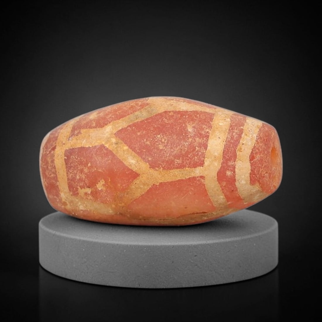 Ancient Carnelian Bead - Gandhara Etched Amulet, 30BD: This ancient Gandhara etched carnelian bead originates from archaeological excavations, crafted from rich reddish-orange carnelian with hand-etched geometric lattice and banded motifs characteristic o