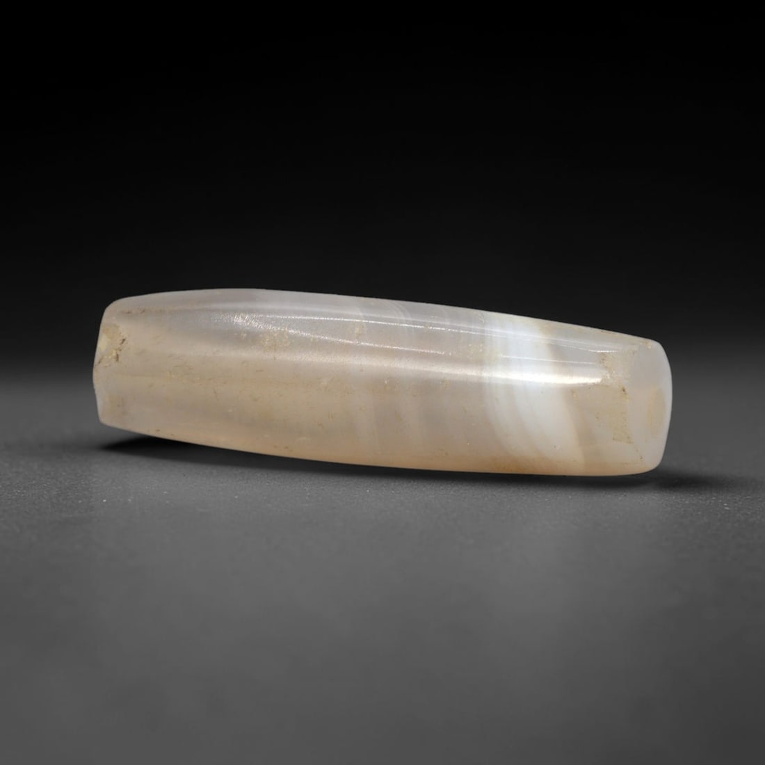 Ancient Agate Bead - Silk Road Jasper Amulet, 98XW: This bead is fashioned from translucent banded agate with distinct white and grey striations, exhibiting the precise lapidary craftsmanship of ancient Silk Road and Western Asiatic bead-making traditi