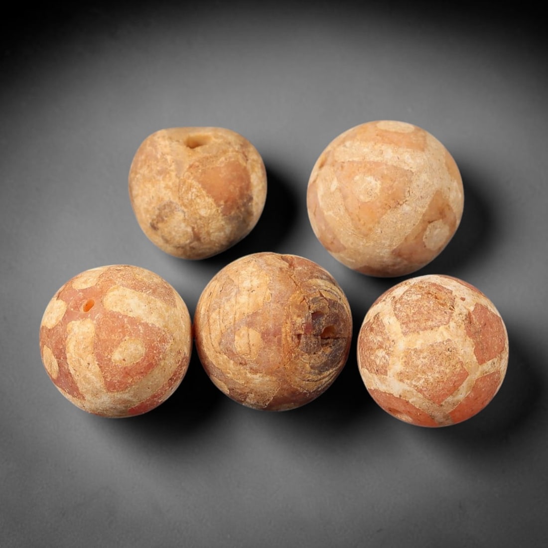 Ancient Carnelian Bead - Gandhara Etched Bead, 46BE: These are five ancient Gandhara etched carnelian beads, crafted from carnelian stone through the process of etching to form distinct geometric patterns on the surface. The beads exhibit a spherical fo