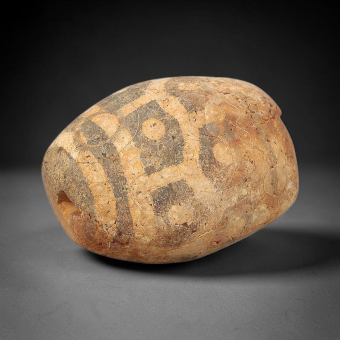 Ancient Carnelian Bead - Gandhara Etched Amulet, 51BD: This ancient Gandhara etched carnelian bead originates from archaeological excavations, crafted from rich reddish-brown carnelian with intricate hand-etched complex eye and banded motifs characteristi