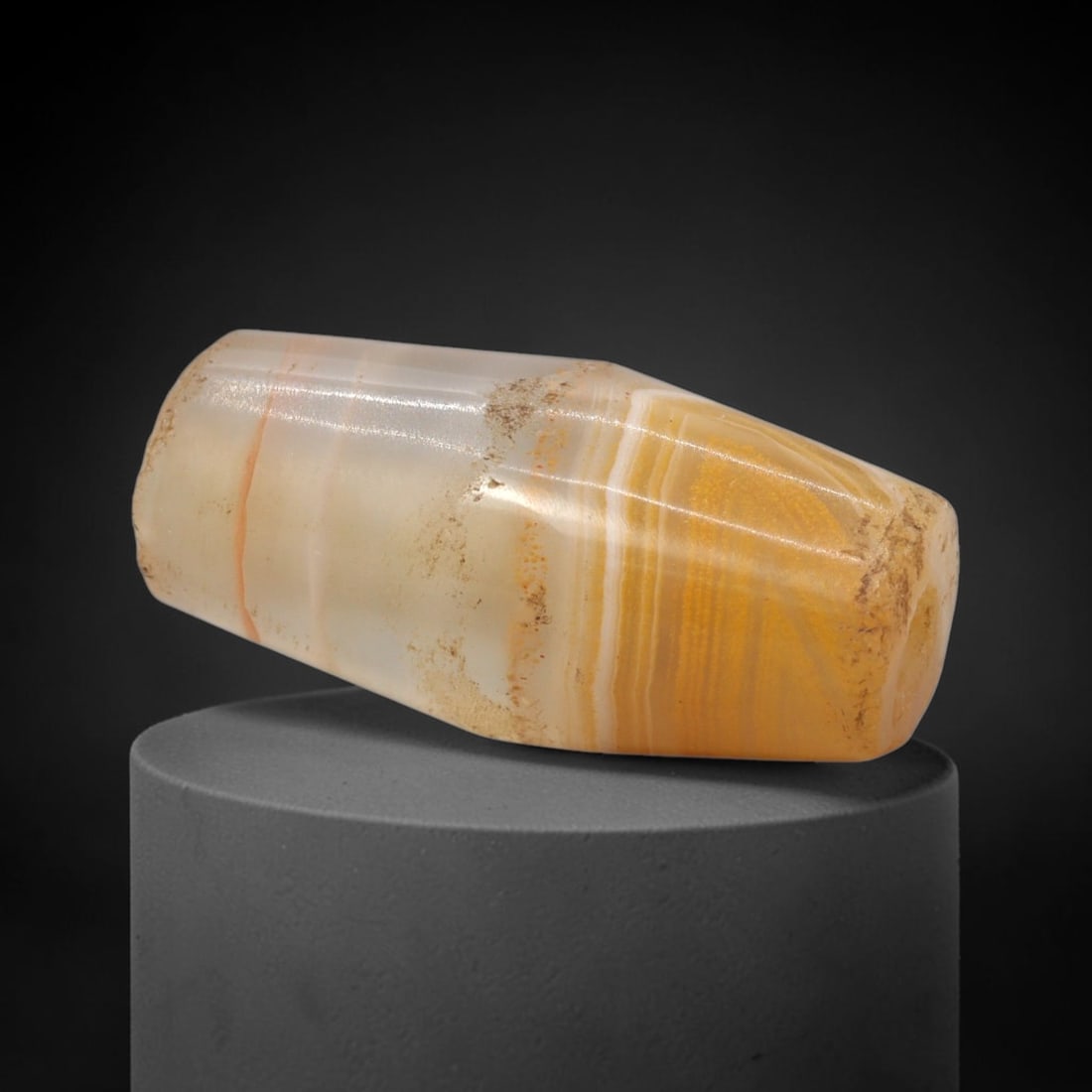 Ancient Banded Agate Bead - Bactrian Western Asiatic Amulet, 53XW: This bead is fashioned from banded agate with striking horizontal stratification of warm golden-yellow and creamy white hues, characteristic of high-quality lapidary craftsmanship from ancient Bactria