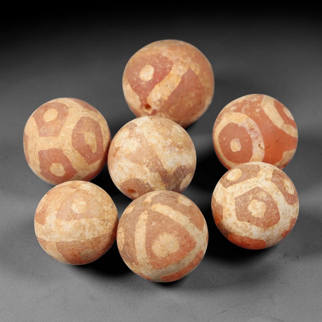 Ancient Carnelian Bead - Gandhara Etched Beads, 49BE: These are seven ancient Gandhara etched carnelian beads, crafted from carnelian stone with traditional etching techniques to create intricate geometric and circular decorative motifs across their sphe