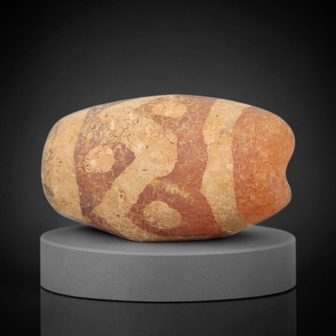 Ancient Carnelian Bead - Gandhara Etched Amulet, 65BD: This ancient Gandhara etched carnelian bead originates from archaeological excavations, crafted from rich red-orange carnelian with hand-etched geometric eye and banded motifs characteristic of Gandha