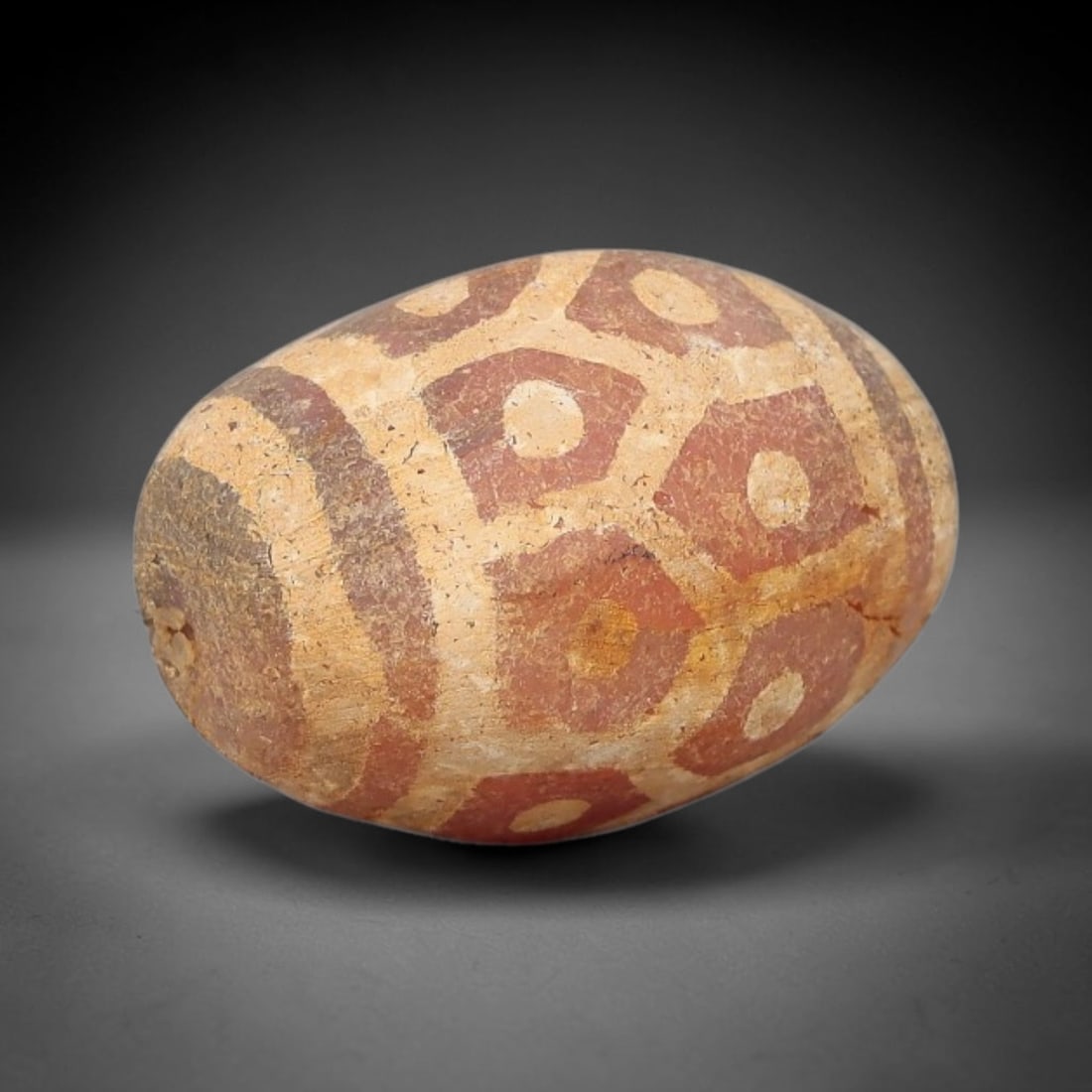 Ancient Carnelian Bead - Gandhara Etched Amulet, 63BD: This ancient Gandhara etched carnelian bead originates from archaeological excavations, crafted from rich red carnelian with intricate hand-etched geometric eye motifs and banded borders characteristi