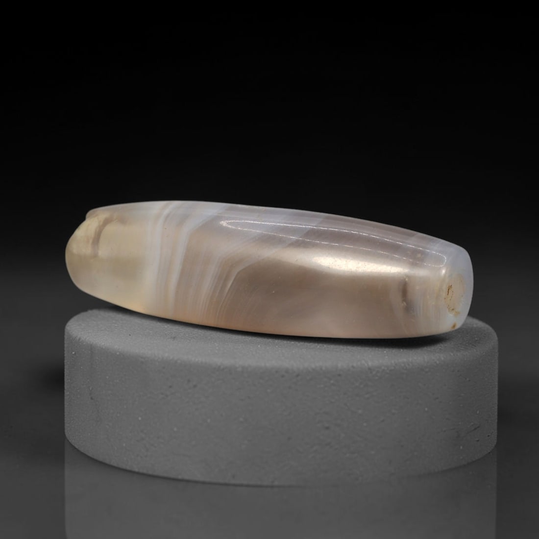 Ancient Banded Agate Bead - Western Asiatic Silk Road Amulet, 95XW: This bead is carved from translucent banded agate with fine concentric stratification and a soft greyish-brown base, characteristic of lapidary craftsmanship from the Western Asiatic and Silk Road cul