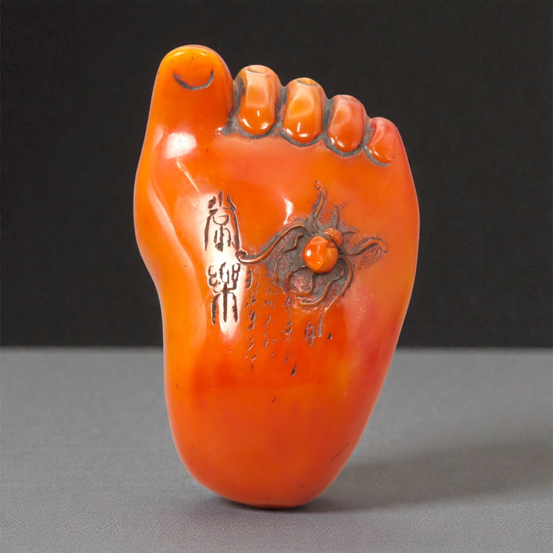 A Chinese Amber-Resin Foot-Form Carving, 20th Century, 64FC (1 of 2)