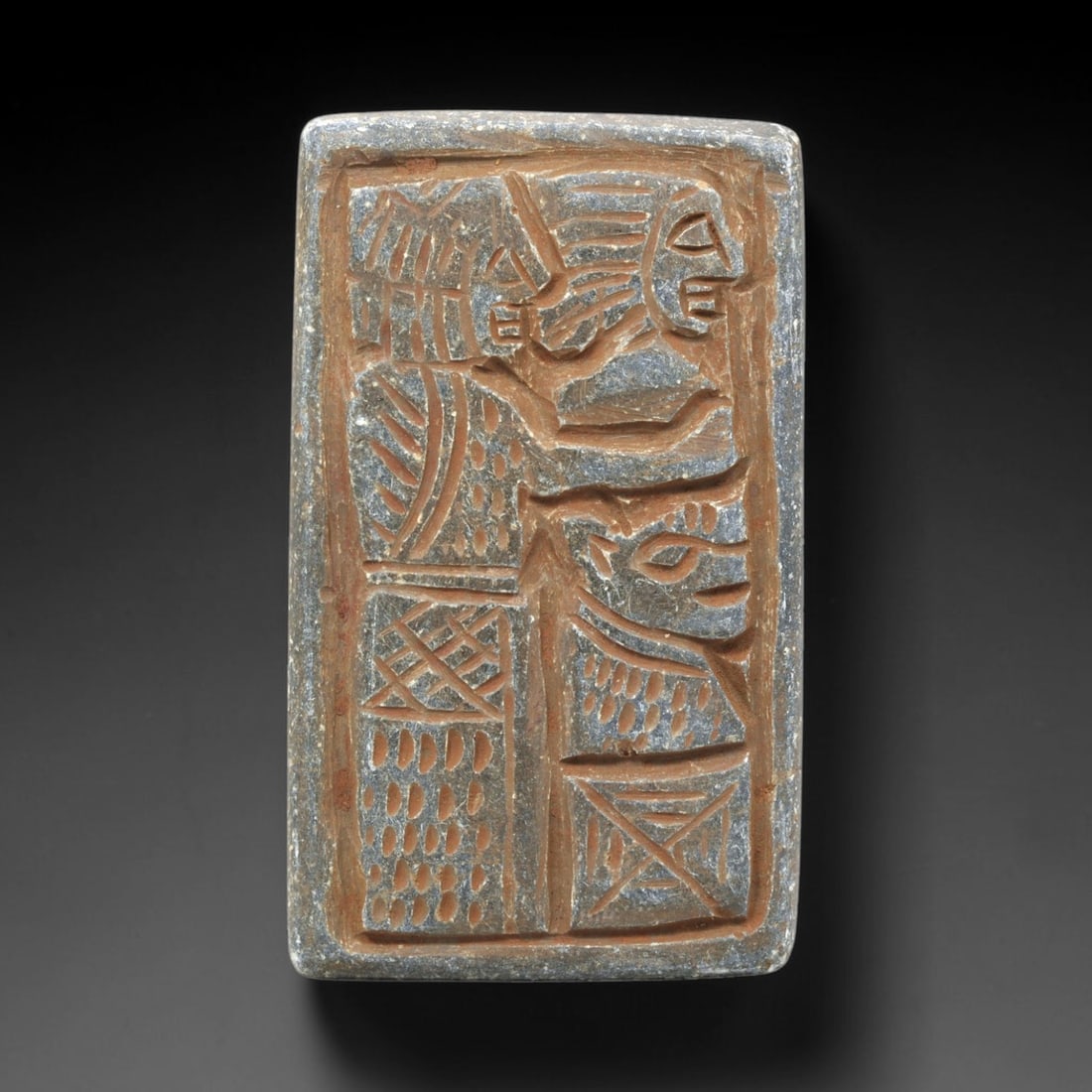 Near Eastern Schist Plaque - Tribal Art Figure & Animal Relief, 11ZA: Carved from schist, this rectangular plaque features a deeply incised relief divided into two vertical sections, depicting a stylized anthropomorphic figure positioned above a stylized animal form, ex