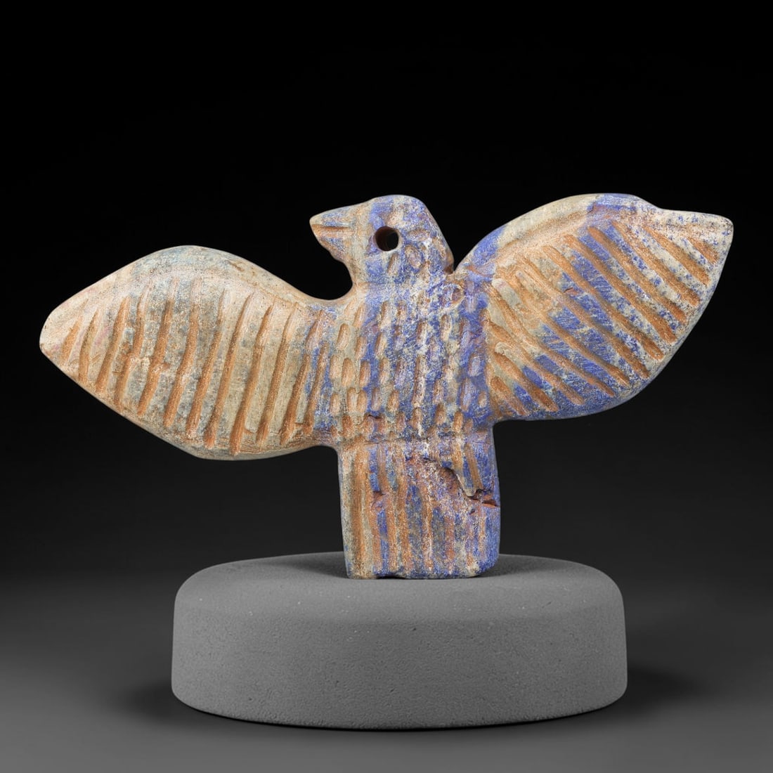 Near Eastern Lapis Lazuli Plaque - Tribal Art Bird Amulet Figurine, 66BF: Carved from solid lapis lazuli, this Near Eastern tribal art piece is shaped as a stylized bird amulet figurine, executed with detailed tribal craftsmanship. The bird is rendered with outstretched win