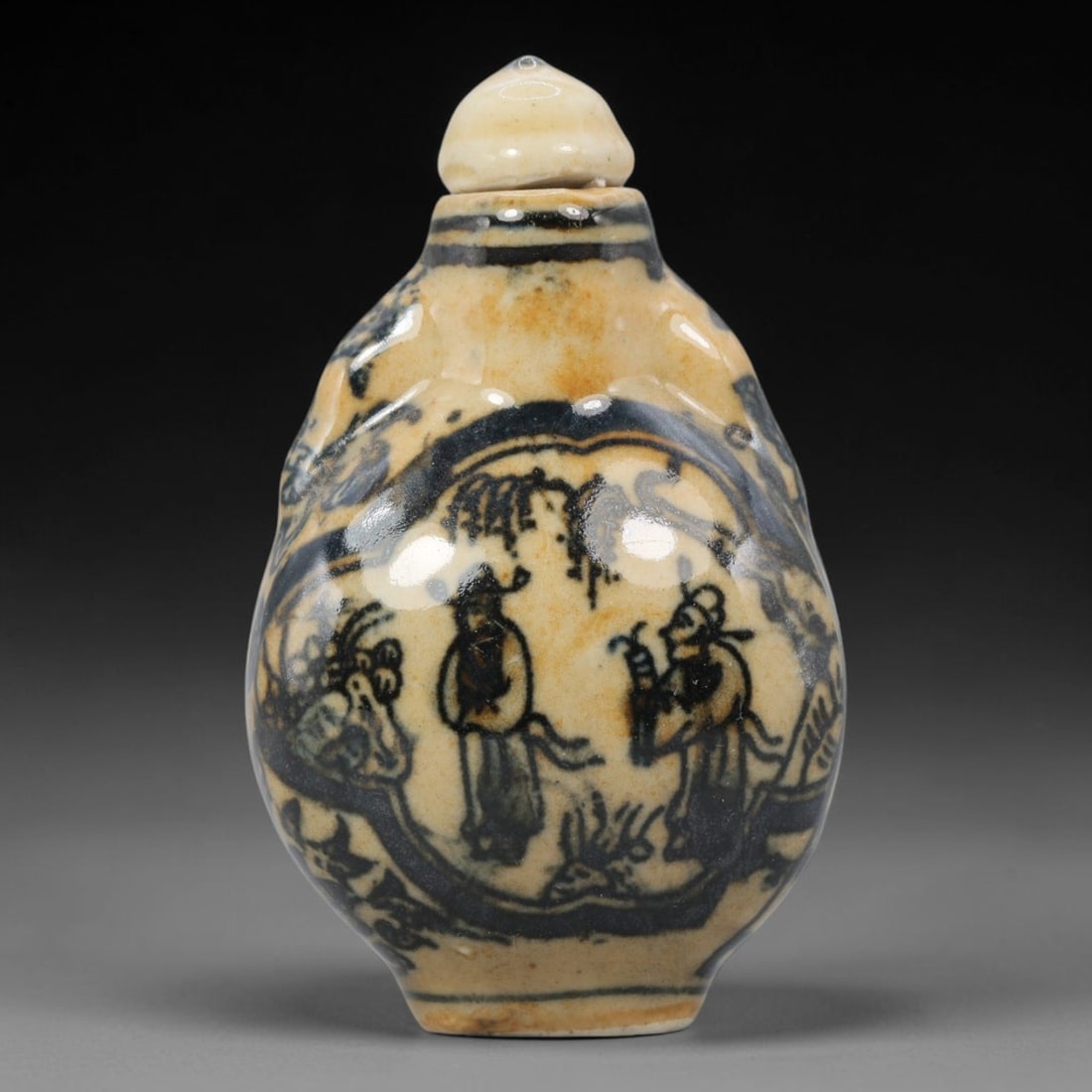 A Chinese Porcelain Snuff Bottle, 20th Century, 5YD: Crafted from porcelain with a creamy white glaze base and decorated in underglaze blue, the snuff bottle features an ovoid body with a short neck and a conforming stopper. The main body is adorned wit