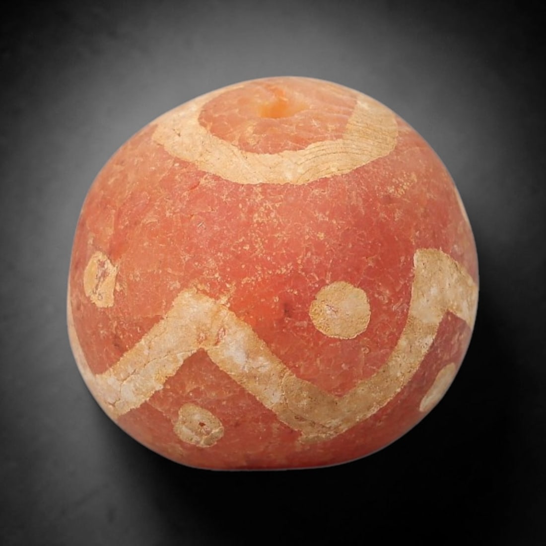 Ancient Carnelian Bead - Gandhara Etched Amulet (Sphere Form), 16BE: This ancient Gandhara etched carnelian bead takes the form of a perfectly rounded sphere, crafted from vibrant reddish-orange carnelian with hand-etched geometric zigzag, circular, and concentric band